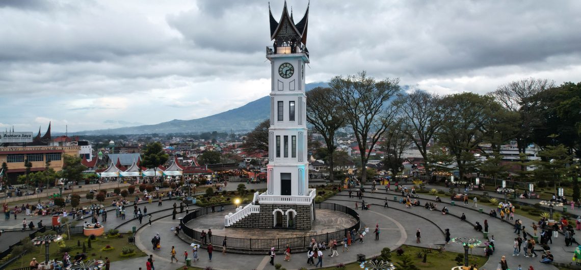 Jam Gadang in Bukittinggi city center, West Sumatra or Panoramic view of Sianok Canyon in Bukittinggi, Indonesia